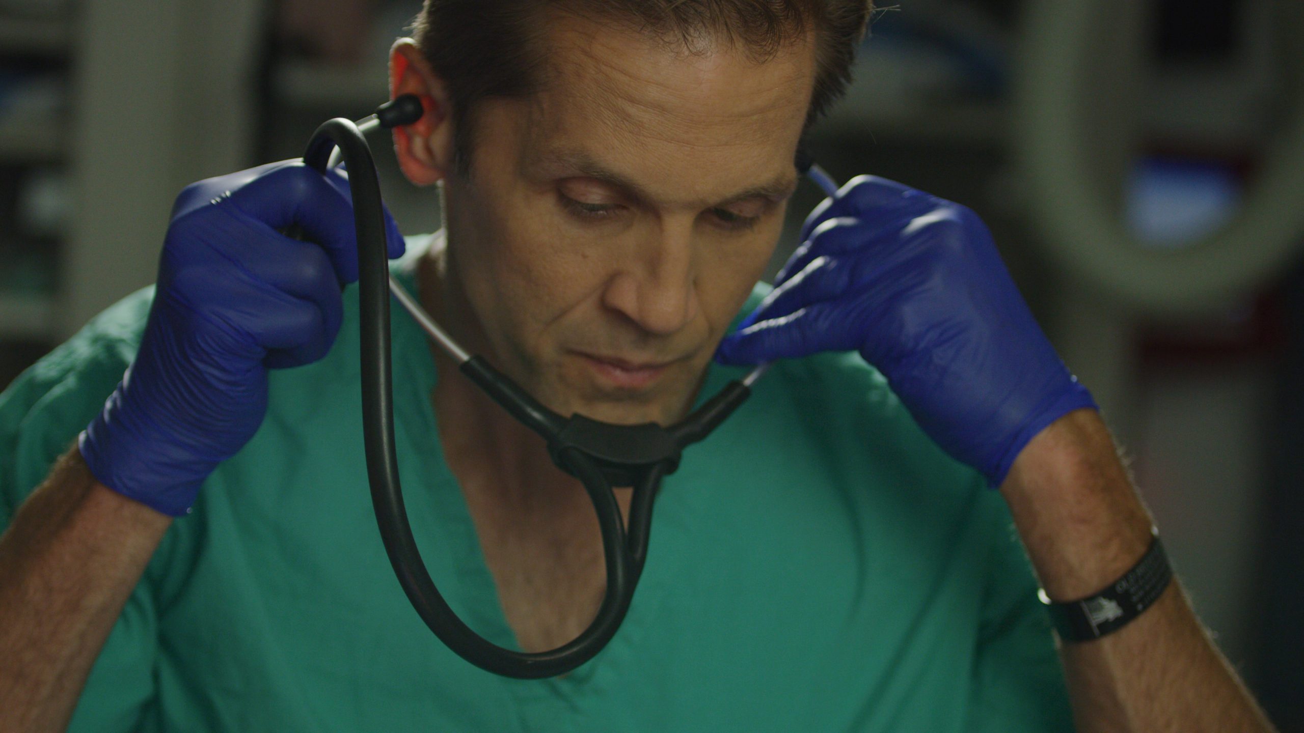 Dr. Rich McCormick putting on his stethoscope in the ER