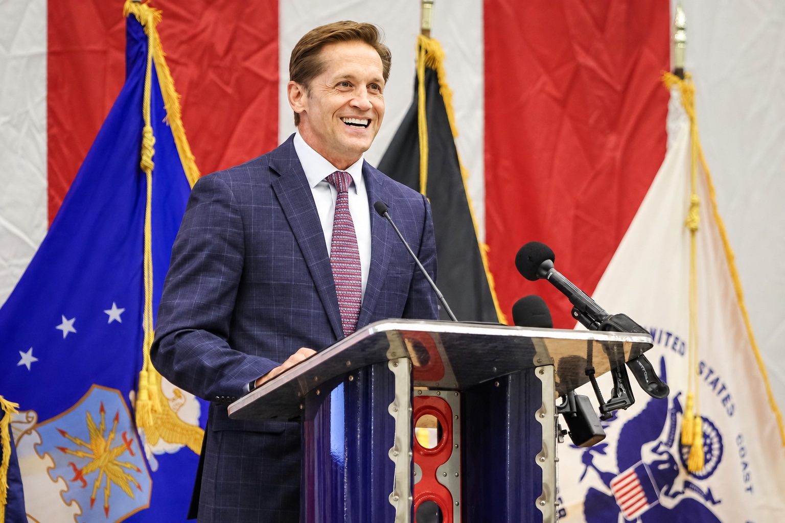 Rich McCormick speaking at a podium with military flags